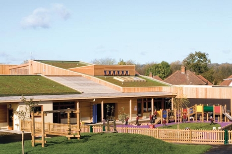 The nursery playground features fruit trees and scented herbs.