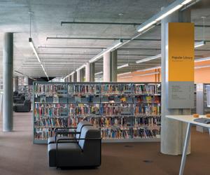 Collectively, the shelves are conceived as a solid mass carved into by the wayward geometry of the perimeter walls.