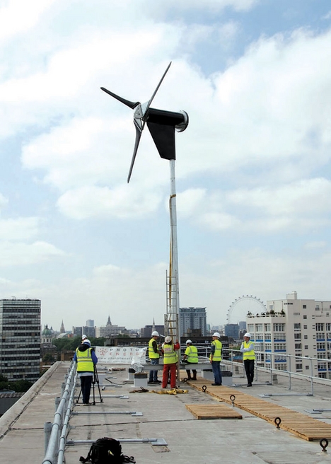 The turbine is raised into position above the south London building.