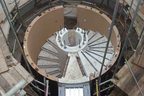 Staircase during construction showing one of the bridges that connects to each floor.