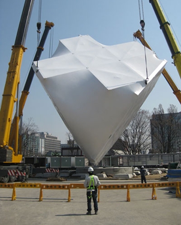 The steel structure is covered in an elastic semi-translucent membrane usually used to store and cover large machinery including airplanes