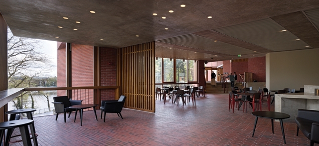 The bar extends around into the foyer, providing extensive glazed views across the valley.