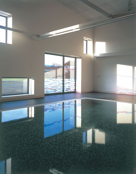 The hydrotherapy pool is fitted with a steel hoist for lifting children in and out.