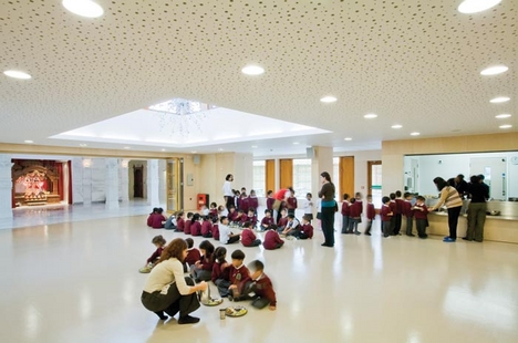 The dining hall is overseen by the altar.