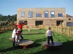 A children’s play area is one of a range of landscapes interposed between the houses. 