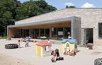 The nursery-level classrooms open onto a zinc covered terrace.