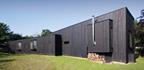 The east elevation has to accommodate a pronounced change of ground level.
