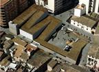 The zigzag roof covers a car park, supermarket, council offices and public market.