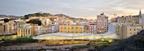 The faceted roof canopy is designed to mediate between the town and the sloping park beyond.