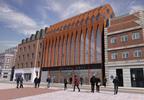 The existing grade II listed building's unlisted extension will be replaced with a new five-storey structure with a principal facade of corten steel,
