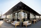 The curtain walling system incorporates 12 hinged double doors.