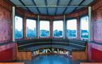 Circular window and seating at one end of the structure.
