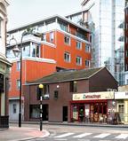 Access to the restaurant, on a site next to a large block of flats, is constrained by the narrow pavement and busy one-way system.