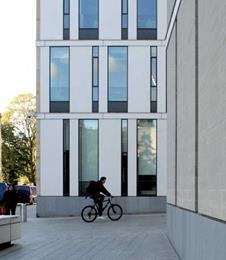 Grey granite forms the hard landscaping and plinth of the buildings.