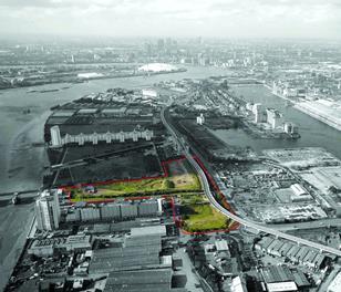 Looking west over the Royal Docks site towards Canary Wharf.