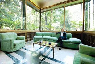 Garden room: David Kohn in his favourite room. Its interwoven marble floor and distinctive window-sill garden escaped changes to the house in the 1950s.