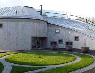 The exterior is set inset with hundreds of triangular titanium plates