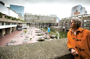 Piers Gough looking over the central terrace and lake area.