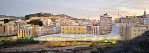 The faceted roof canopy is designed to mediate between the town and the sloping park beyond.