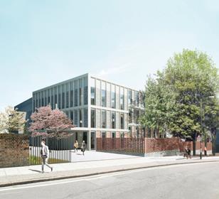 Bays of brick and glass alternate between the grid of concrete fins that defines the learning centre’s exterior.