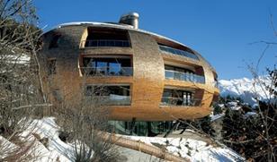 The kidney bean-shaped Chesa Futura apartments in St Moritz by Foster’s.