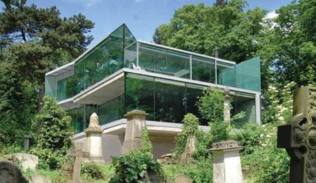 The three-storey home overlooks Highgate Cemetery.
