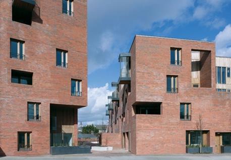 The two buildings frame a narrow entrance to the yard on Cork Street.