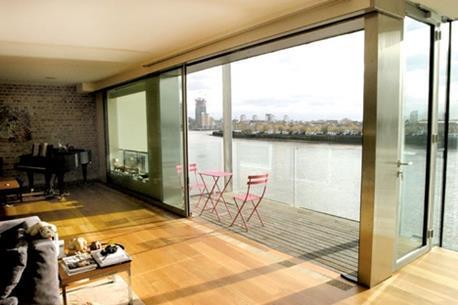 View to the new second floor balcony. The motorised door slides over the fixed window to the left.