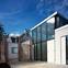 Black silicone, white Sto render and glass define the structure’s clean design.