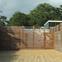 Iroko slats in the front garden will become an effective green wall, hiding the house from view.