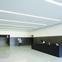 The entrance lobby is lined with dark grey pigmented MDF.