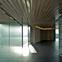 The 500kg glass door of the large multipurpose room slides open to connect the room to the entrance and library space.